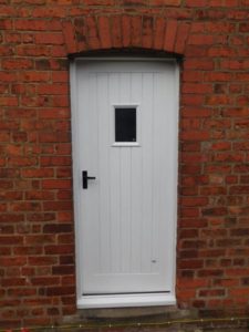 Tongue and groove panelled door in white by Cheshire Joinery Services