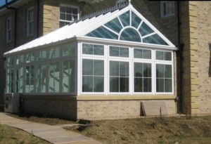 gable fronted conservatory white framing brick base